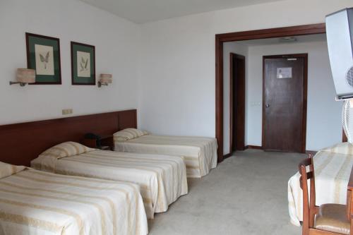 Habitación Cuádruple del hotel Residencial Greco