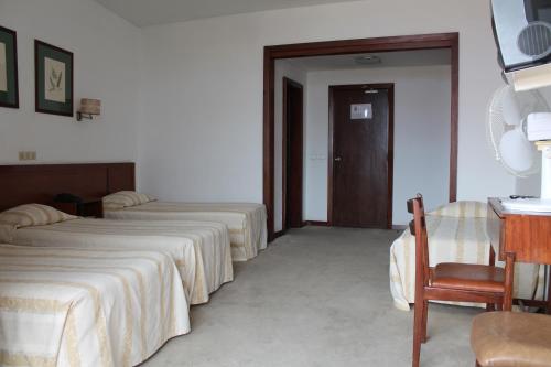 Habitación Cuádruple del hotel Residencial Greco. Foto 1