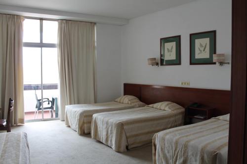 Habitación Cuádruple del hotel Residencial Greco. Foto 3
