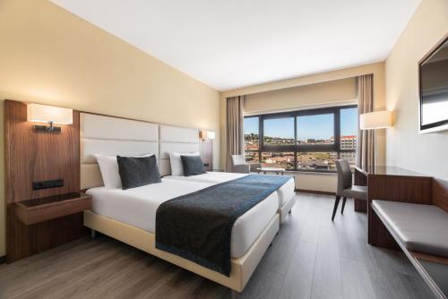 Habitación Doble Deluxe con aparcamiento gratuito - 2 camas del hotel Exe São Lázaro