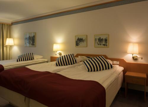 Habitación Triple del hotel 2home Stockholm South. Foto 1