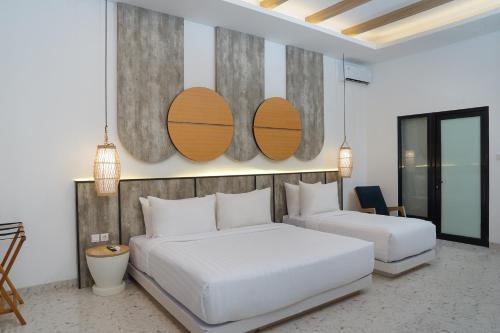 Habitación Triple Deluxe Garden del hotel Jambuluwuk Oceano Resort Gili Trawangan. Foto 6