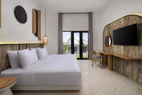 Habitación Doble Deluxe con jardín del hotel Jambuluwuk Oceano Resort Gili Trawangan. Foto 1