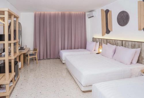 Habitación Cuádruple Deluxe del hotel Jambuluwuk Oceano Resort Gili Trawangan. Foto 5