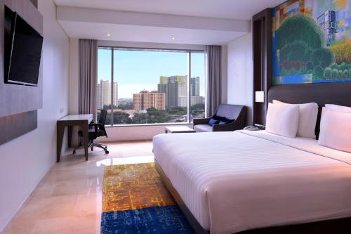 Habitación Deluxe con 1 cama king del hotel Grand Mercure Jakarta Kemayoran. Foto 2