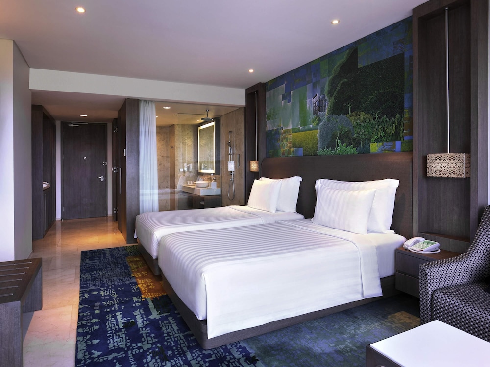 Habitación Deluxe con 2 camas individuales del hotel Grand Mercure Jakarta Kemayoran. Foto 5