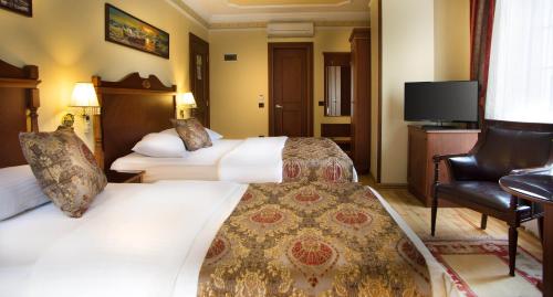 Habitación Triple del hotel Best Western Empire Palace and Spa - Special Class. Foto 1