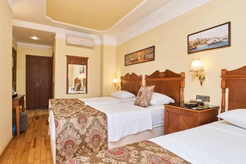 Habitación Triple del hotel Best Western Empire Palace and Spa - Special Class. Foto 7
