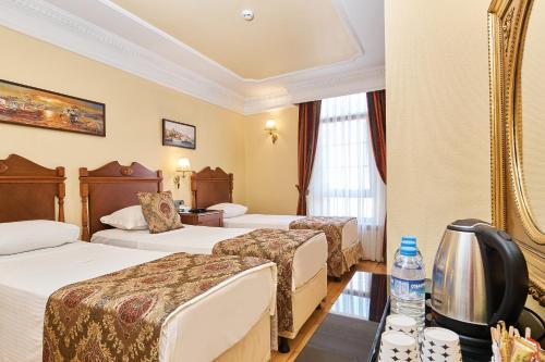 Habitación Triple del hotel Best Western Empire Palace and Spa - Special Class. Foto 8