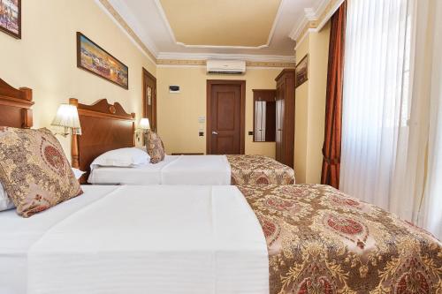 Habitación Triple del hotel Best Western Empire Palace and Spa - Special Class. Foto 9