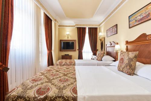 Habitación Triple del hotel Best Western Empire Palace and Spa - Special Class. Foto 10