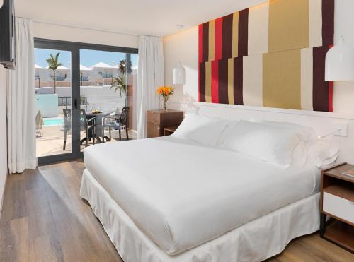 Habitación Doble con vistas a la piscina - 1 o 2 camas del hotel H10 Ocean Dreams Boutique - Adults Only. Foto 1