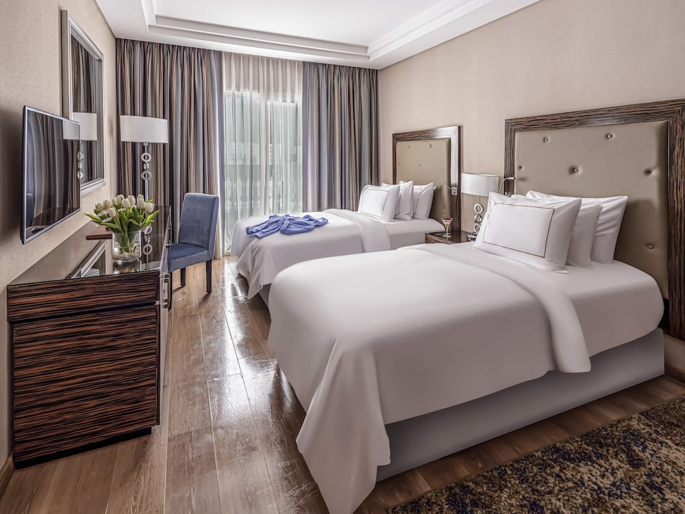 Suite Vista Jardín Superior 1 Cama king 2 Camas individuales del hotel Rixos Premium Seagate. Foto 1
