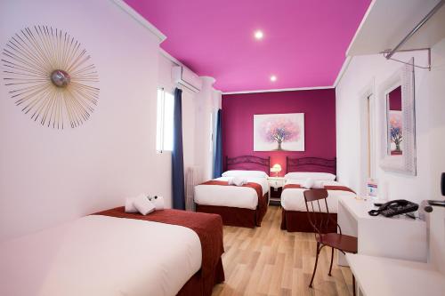 Habitación Triple del hotel Casual Valencia Vintage. Foto 8