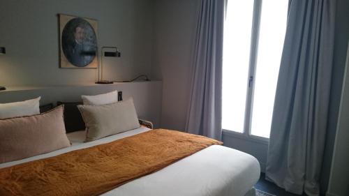 Habitación Doble Deluxe del hotel Coq Paris. Foto 4