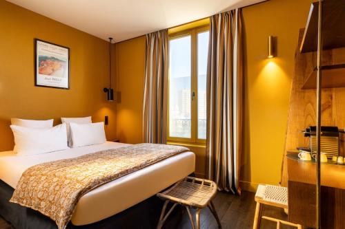 Habitación Clásica del hotel Coq Paris. Foto 1