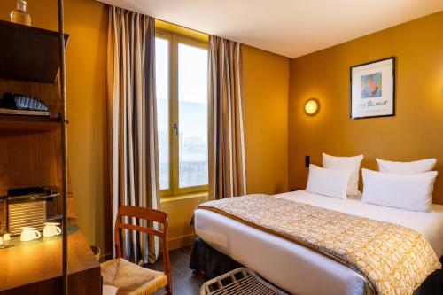 Habitación Clásica del hotel Coq Paris. Foto 3