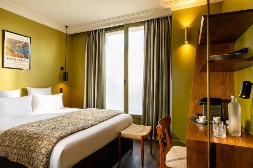 Habitación Clásica del hotel Coq Paris. Foto 8