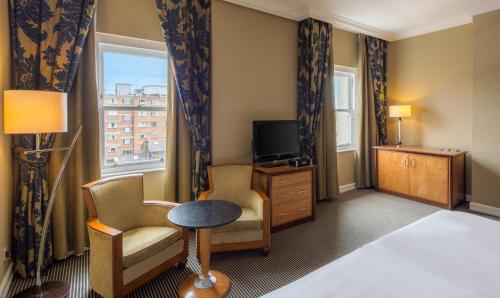 Suite Queen con acceso al salón del hotel Hilton London Paddington. Foto 3