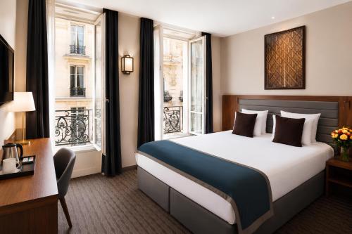 Habitación Deluxe con cama extragrande del hotel Mayflower Opéra. Foto 3