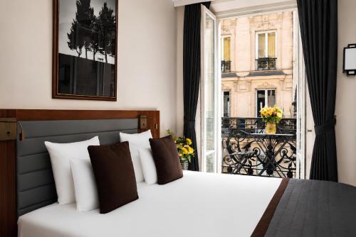 Deluxe King Room with King Bed and Balcony del hotel Mayflower Opéra. Foto 3