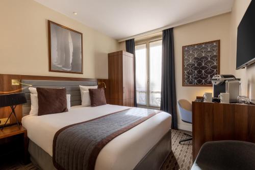 Habitación Clásica con cama grande del hotel Mayflower Opéra. Foto 2