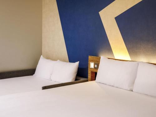 Habitación Familiar Clásica del hotel ibis budget London Heathrow Central. Foto 13