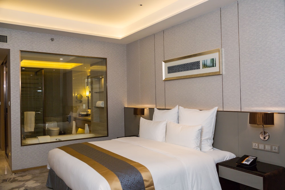 Suite con 1 Cama King del hotel Pullman Changshu Leeman. Foto 1