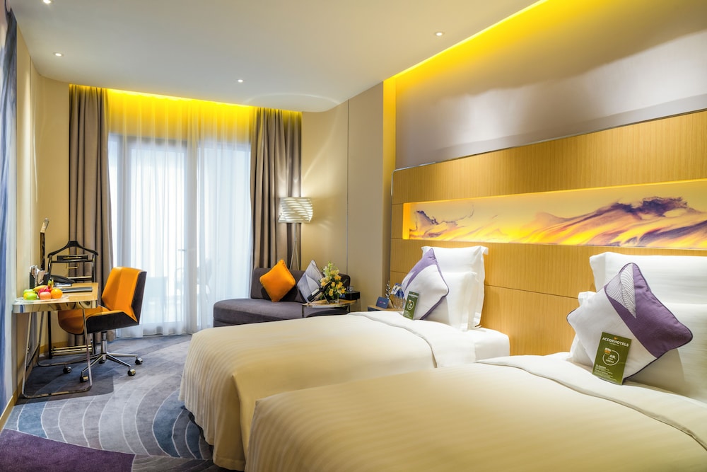 Habitación Deluxe con Dos Camas Individuales y Balcón del hotel Novotel Suzhou Sip. Foto 5