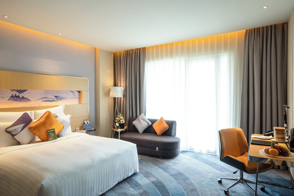 Habitación Deluxe con Una Cama King - Size y Balcón del hotel Novotel Suzhou Sip. Foto 2