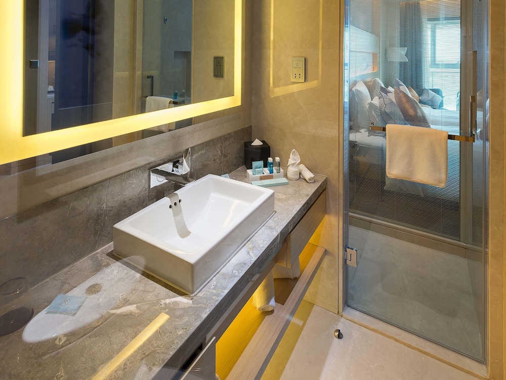 Habitación superior con 2 camas individuales del hotel Novotel Suzhou Sip. Foto 5