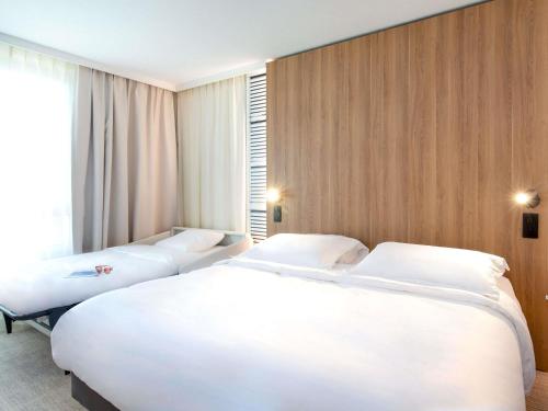 Habitación Doble Clásica con sofá cama del hotel Novotel Aix En Provence Beaumanoir Les 3 Sautets