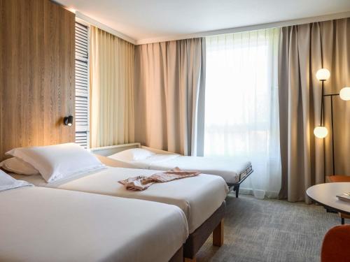 Habitación Doble Estándar - 2 camas del hotel Novotel Aix En Provence Beaumanoir Les 3 Sautets. Foto 4