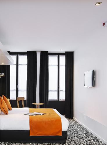Suite Junior con sofá cama - Cama doble grande del hotel Best Western Premier Faubourg 88. Foto 6