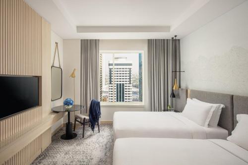 Habitación de nuevo diseño - 2 camas del hotel Towers Rotana. Foto 1