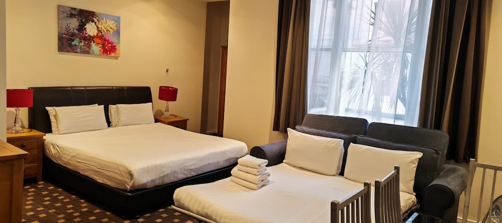 Estudio Cuádruple del hotel Grand Plaza Serviced Apartments. Foto 33