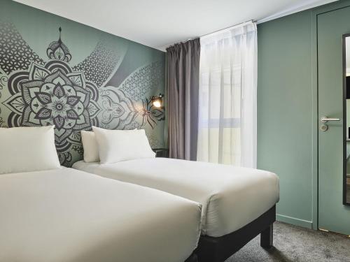 Habitación Doble Estándar - 2 camas del hotel Ibis Styles Paris Gare De L'est Magenta. Foto 6