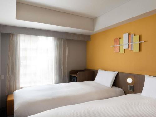 Habitación Doble Estándar - 2 camas del hotel Ibis Styles Kyoto Shijo. Foto 7