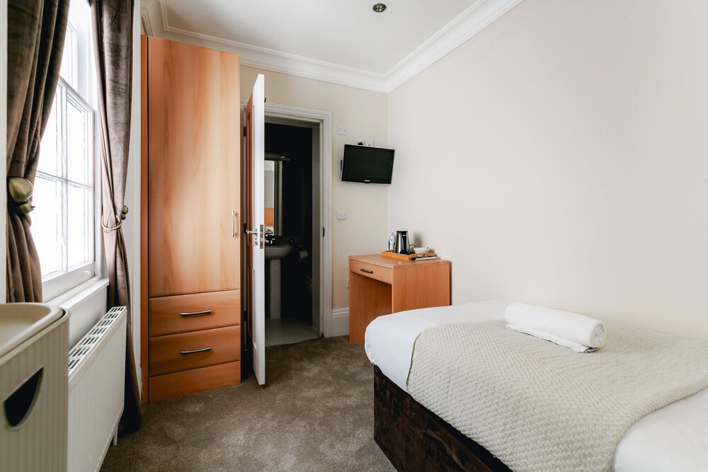 Habitación individual, baño privado del hotel Mina House. Foto 7