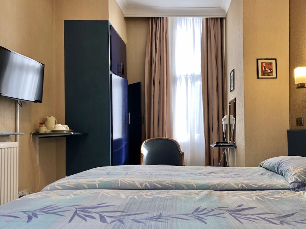 Habitación superior con 2 camas individuales del hotel Mitre House. Foto 3