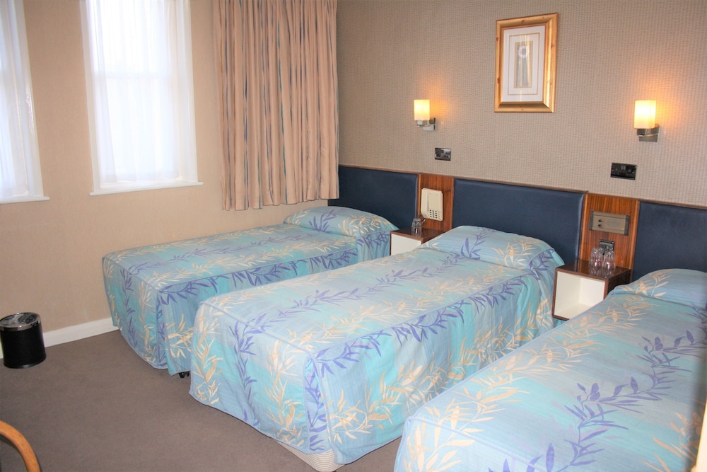 Habitación triple del hotel Mitre House