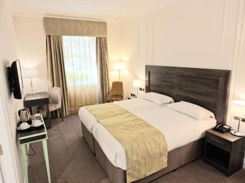 Habitación Cuádruple Estándar del hotel Astor Court. Foto 3