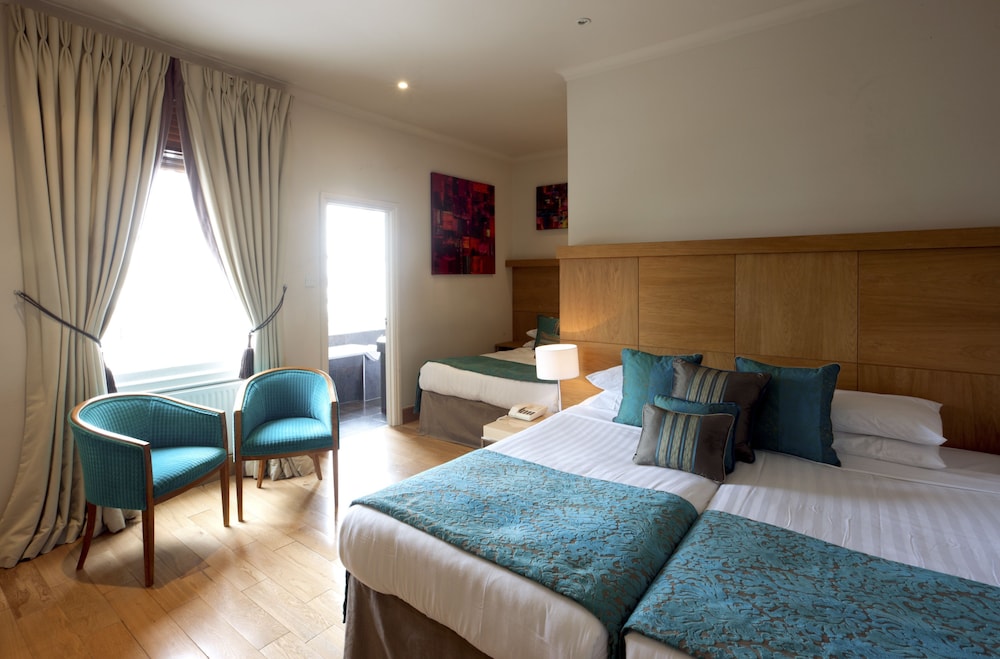 Habitación cuádruple estándar del hotel New Linden. Foto 1