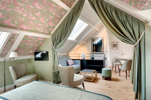 Suite Ático del hotel Les Rives De Notre Dame. Foto 6