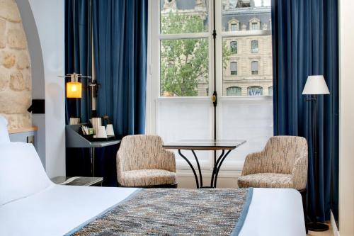Habitación Doble Estándar del hotel Les Rives De Notre Dame. Foto 7