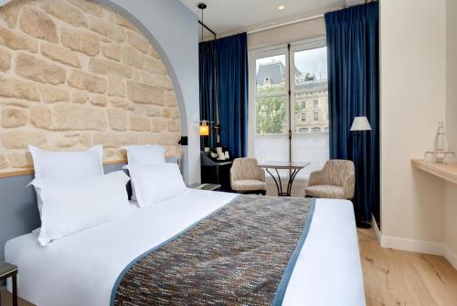 Habitación Doble Estándar del hotel Les Rives De Notre Dame. Foto 8