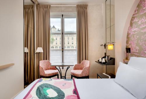 Habitación Doble Estándar del hotel Les Rives De Notre Dame. Foto 17