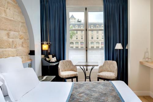 Habitación Doble Estándar del hotel Les Rives De Notre Dame. Foto 20