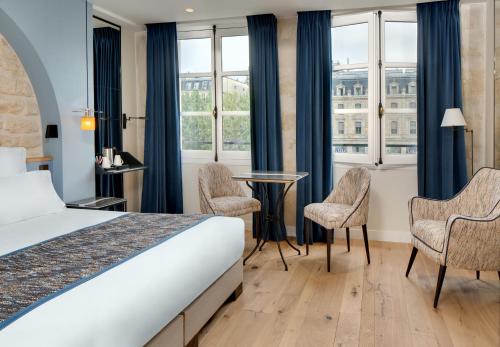 Habitación Doble Superior del hotel Les Rives De Notre Dame. Foto 14