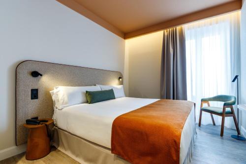Habitación Doble con vistas a la ciudad del hotel Petit Palace Puerta del Sol. Foto 1